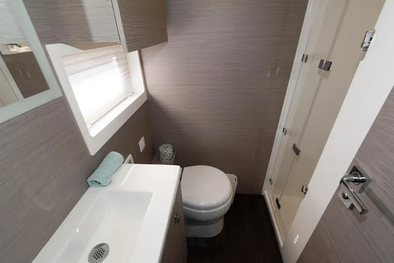 Slide: The Image of Modern bathroom in 2022 Fountaine Pajot MY6 yacht with sink, toilet, and shower. - 47