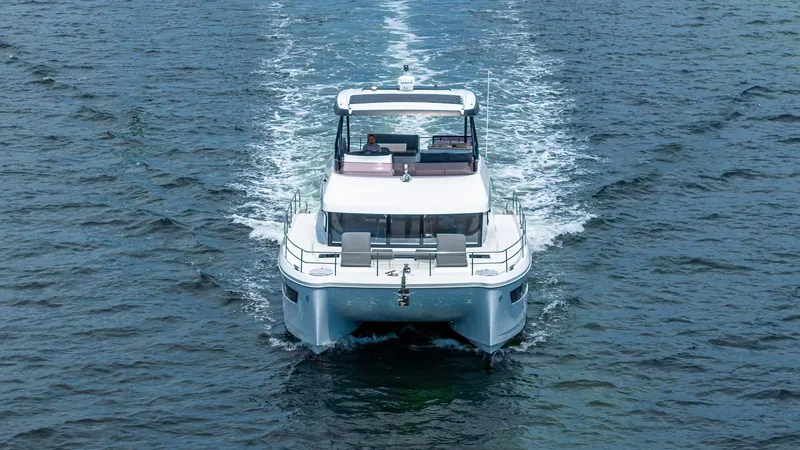 Slide: The Image of 2022 Fountaine Pajot MY6 yacht cruising on open water. - 5