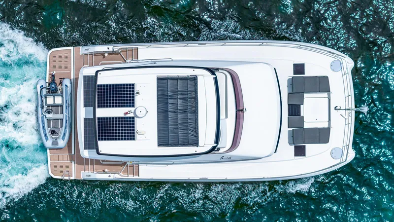 Slide: The Image of Aerial view of 2022 Fountaine Pajot MY6 yacht cruising on water. - 6