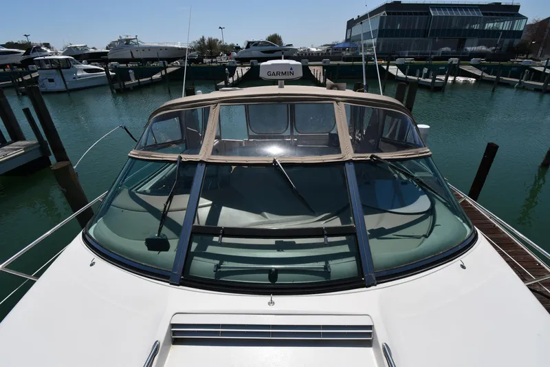 Slide: The Image of 1998 Sea Ray 500 Sundancer yacht docked at marina, front view. - 10