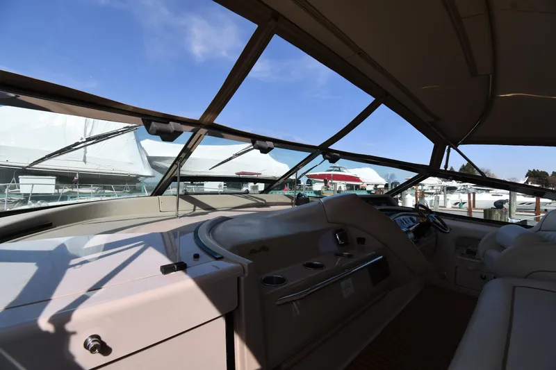 Slide: The Image of Interior view of 1998 Sea Ray 500 Sundancer yacht cockpit with panoramic windows. - 11