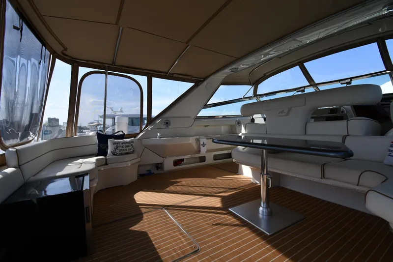 Slide: The Image of 1998 Sea Ray 500 Sundancer yacht interior with spacious seating and elegant design. - 23