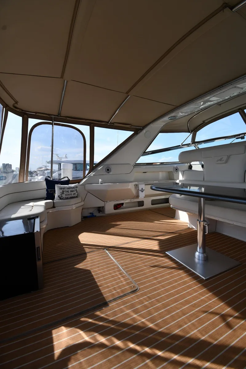 Slide: The Image of 1998 Sea Ray 500 Sundancer interior with spacious seating and elegant design. - 24