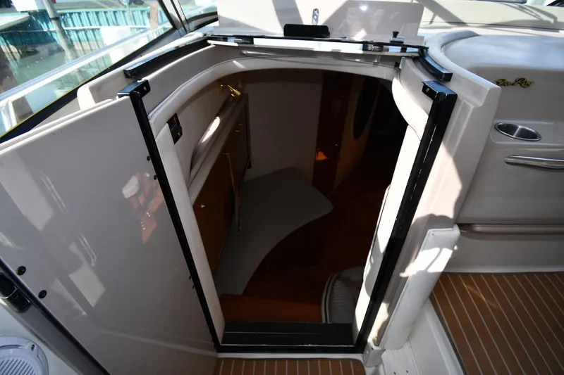 Slide: The Image of Entrance to cabin of 1998 Sea Ray 500 Sundancer yacht, featuring sleek interior design. - 30