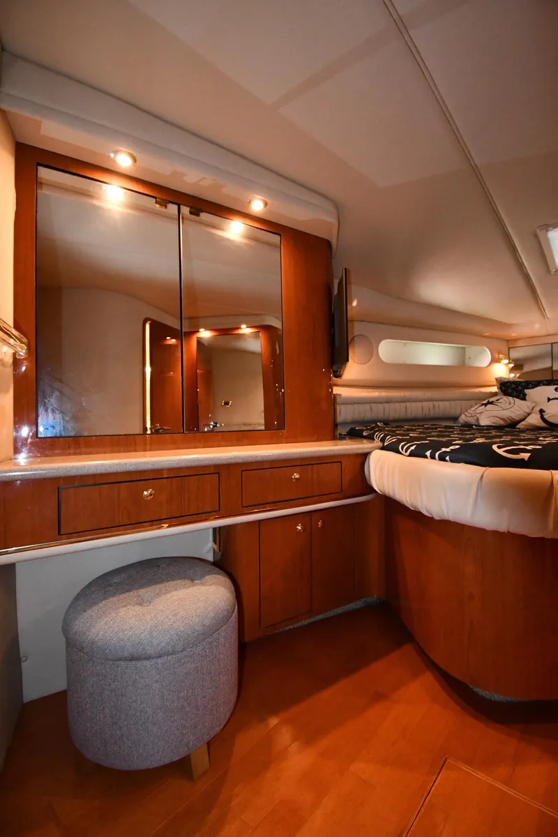 Slide: The Image of Luxurious interior of 1998 Sea Ray 500 Sundancer yacht with vanity and seating. - 34