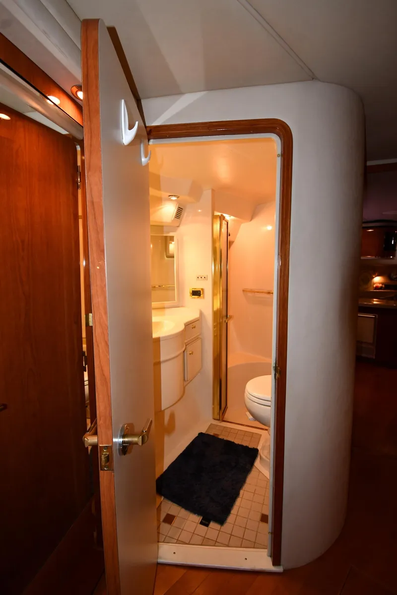 Slide: The Image of 1998 Sea Ray 500 Sundancer yacht bathroom interior with modern fixtures and compact design. - 37