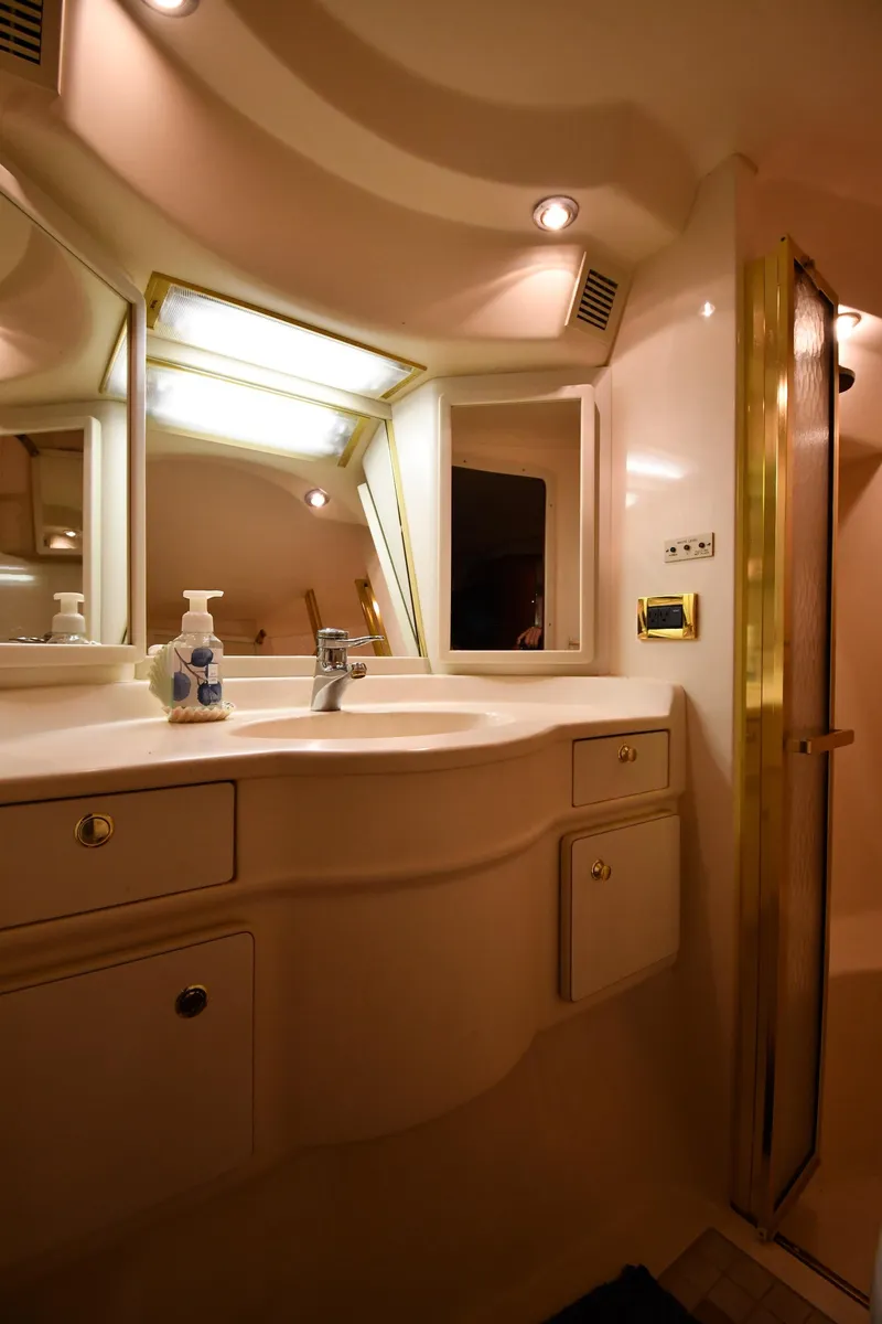 Slide: The Image of Luxurious bathroom interior of 1998 Sea Ray 500 Sundancer yacht with elegant fixtures. - 39