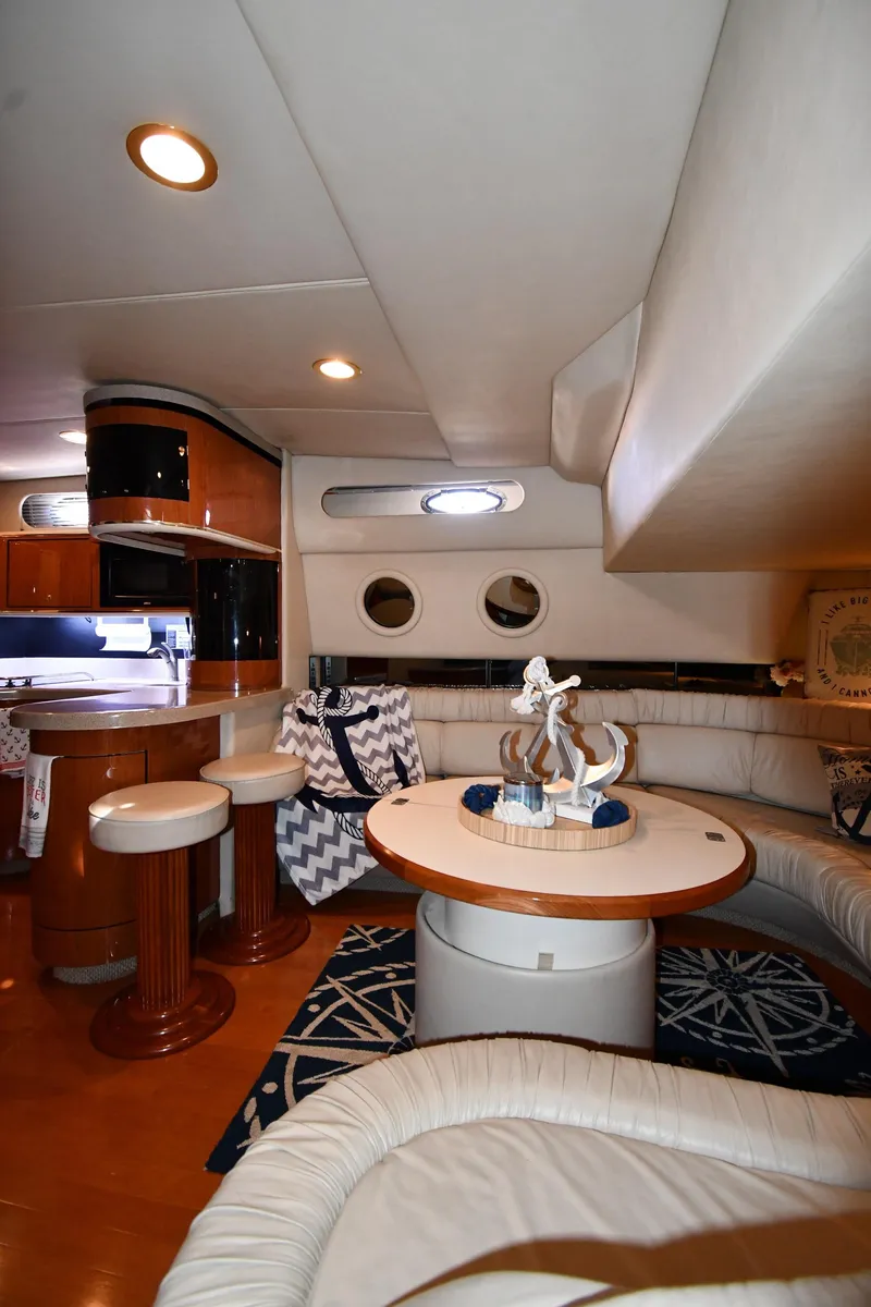 Slide: The Image of Luxurious interior of 1998 Sea Ray 500 Sundancer yacht with elegant seating and decor. - 41