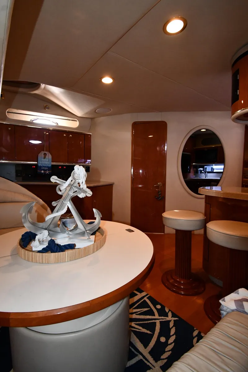 Slide: The Image of Interior of 1998 Sea Ray 500 Sundancer yacht with elegant seating and nautical decor. - 42