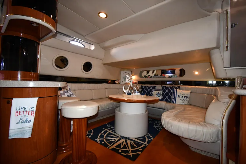 Slide: The Image of Luxurious interior of a 1998 Sea Ray 500 Sundancer yacht with elegant seating and decor. - 44