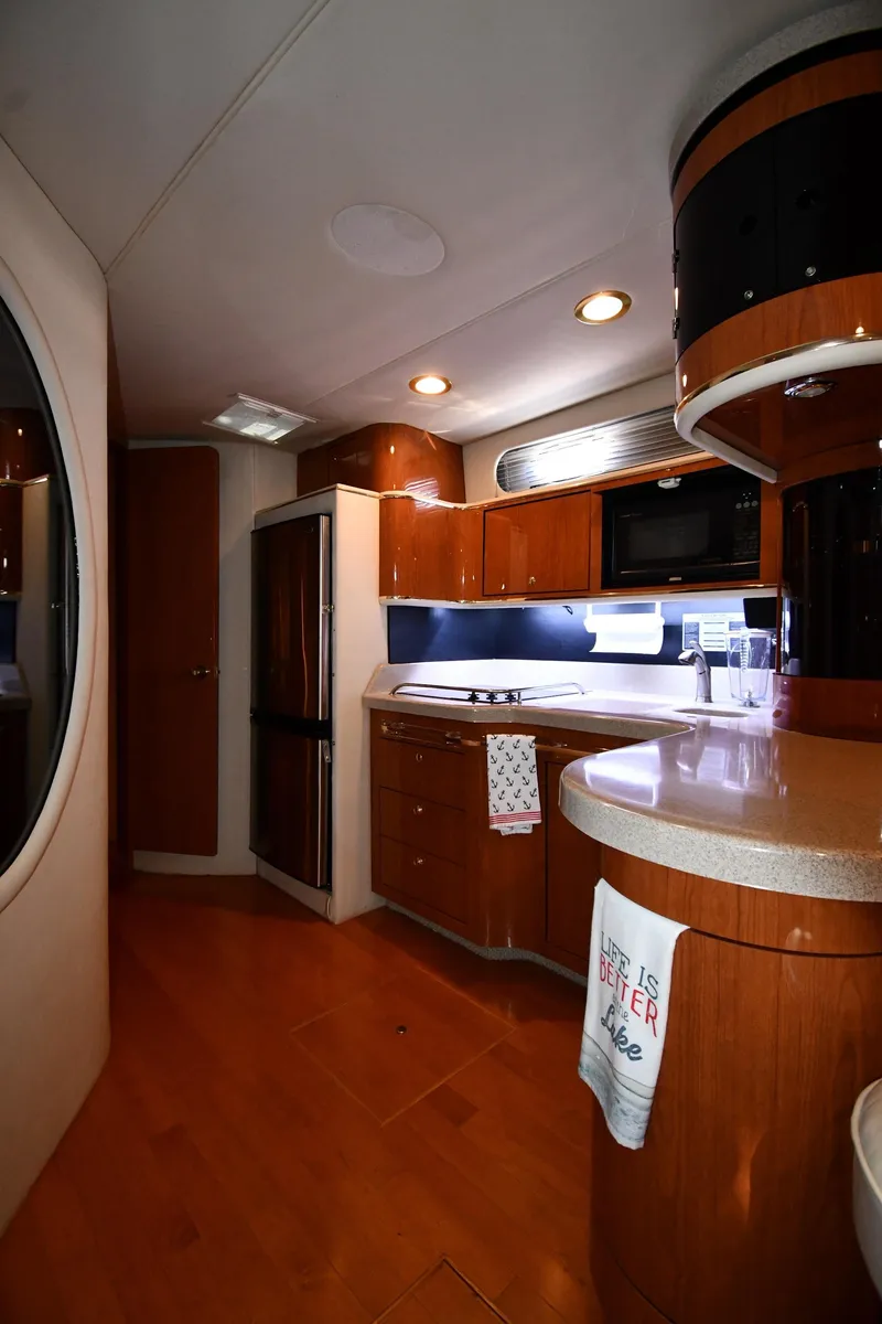 Slide: The Image of Luxurious interior of 1998 Sea Ray 500 Sundancer yacht kitchen area. - 47