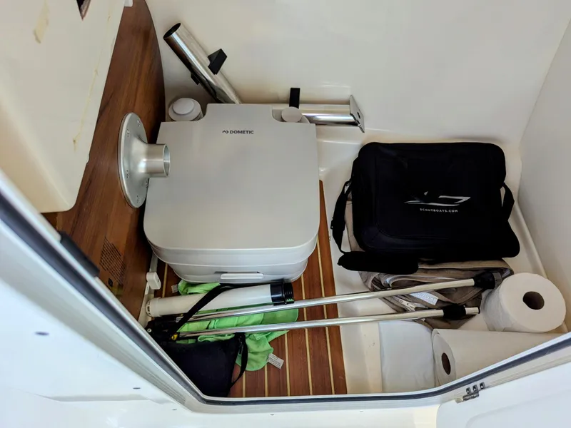 Slide: The Image of 2022 Scout 215 Dorado boat storage with portable toilet and accessories. - 17
