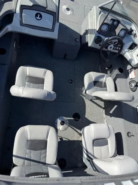Slide: The Image of 2017 Tracker PGV175 boat interior with four seats and steering console. - 6