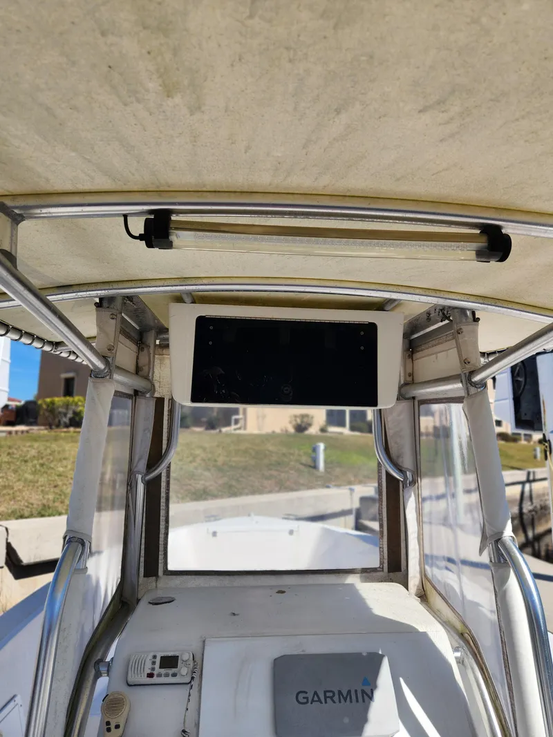 Slide: The Image of 2007 Clearwater 23cc boat interior with Garmin equipment and canopy. - 10