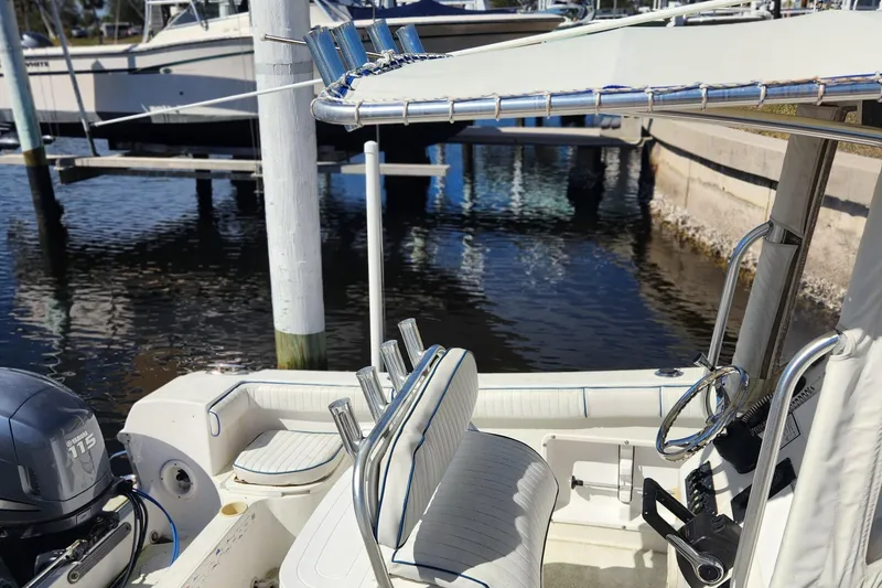 Slide: The Image of 2007 Clearwater 23cc boat interior at a marina dock. - 4