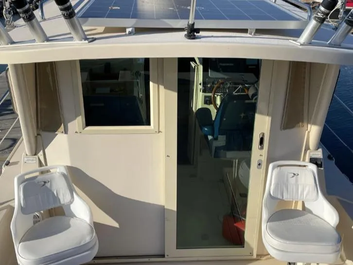 Slide: The Image of 2006 Albin 28 Tournament Express boat with cockpit seating and helm view. - 16