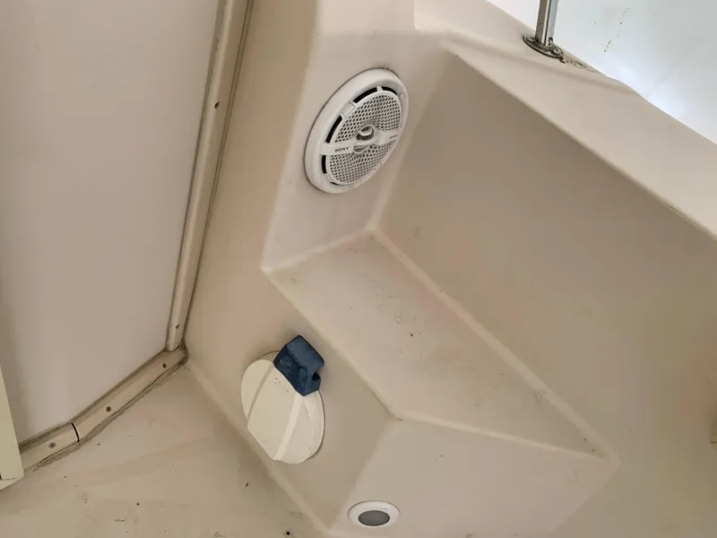 Slide: The Image of 2006 Albin 28 Tournament Express boat interior with speaker and storage compartment. - 20