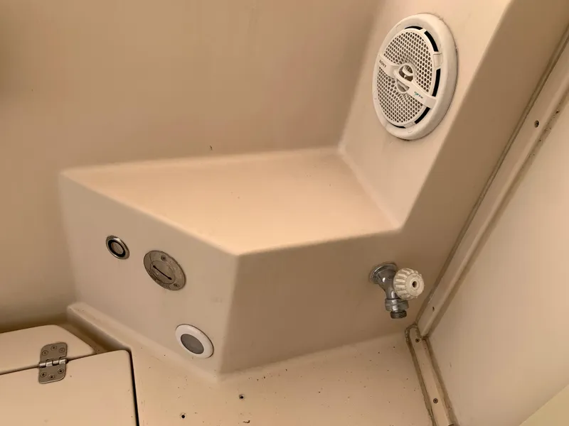 Slide: The Image of Interior of 2006 Albin 28 Tournament Express boat, featuring speaker and control panel. - 30