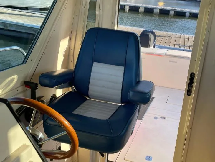 Slide: The Image of Captain's chair in 2006 Albin 28 Tournament Express boat cockpit. - 35