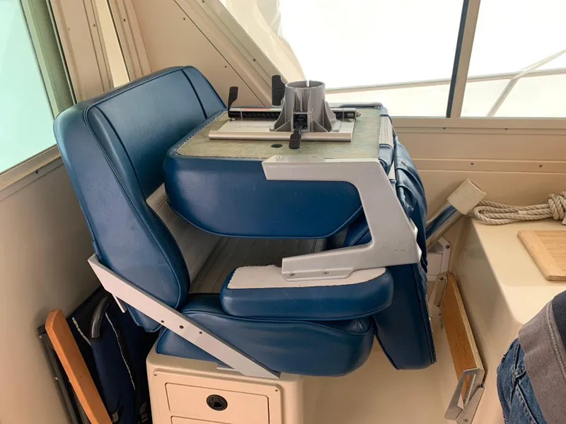 Slide: The Image of Blue captain's chair in 2006 Albin 28 Tournament Express boat interior. - 37