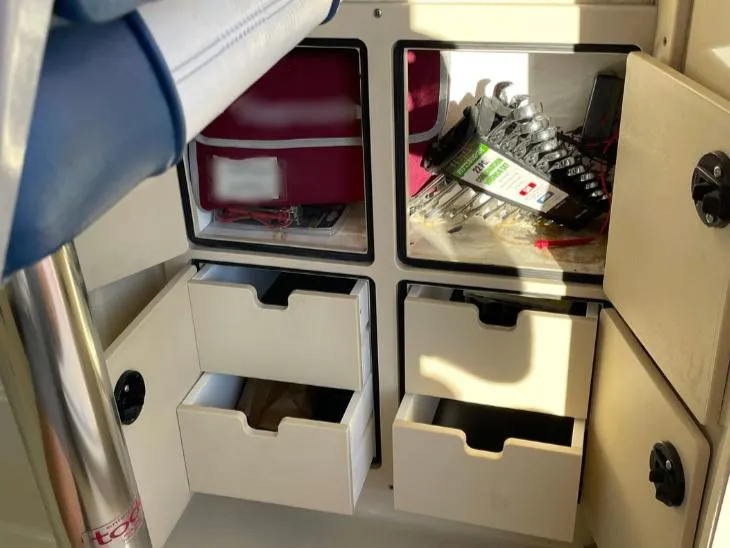 Slide: The Image of Storage compartments and drawers inside a 2006 Albin 28 Tournament Express boat. - 39