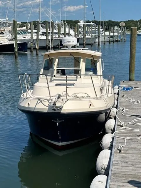 Slide: The Image of 2006 Albin 28 Tournament Express docked at a marina, clear sky, calm water. - 4