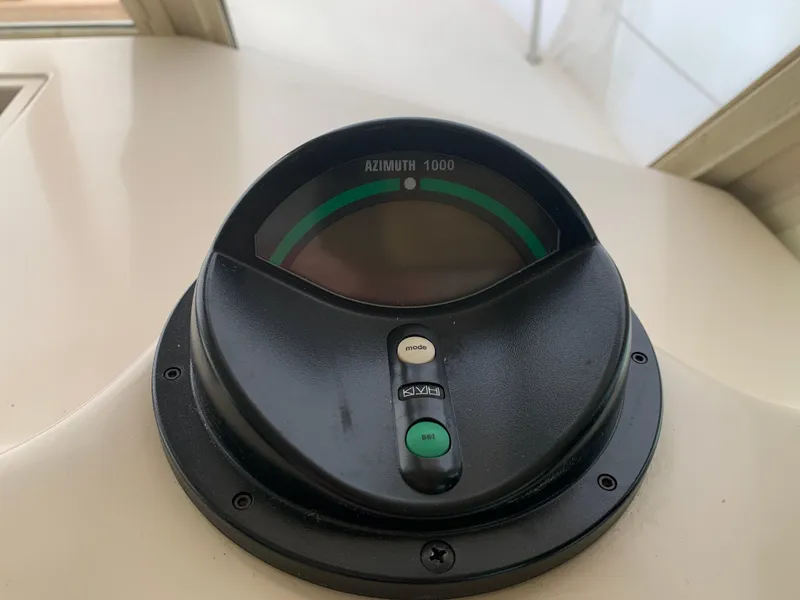 Slide: The Image of Azimuth 1000G compass on 2006 Albin 28 Tournament Express boat dashboard. - 42