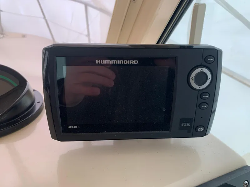 Slide: The Image of Humminbird Helix 5 fish finder on 2006 Albin 28 Tournament Express boat dashboard. - 43