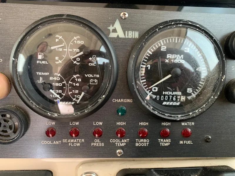 Slide: The Image of Instrument panel of a 2006 Albin 28 Tournament Express boat, showing gauges and warning lights. - 44