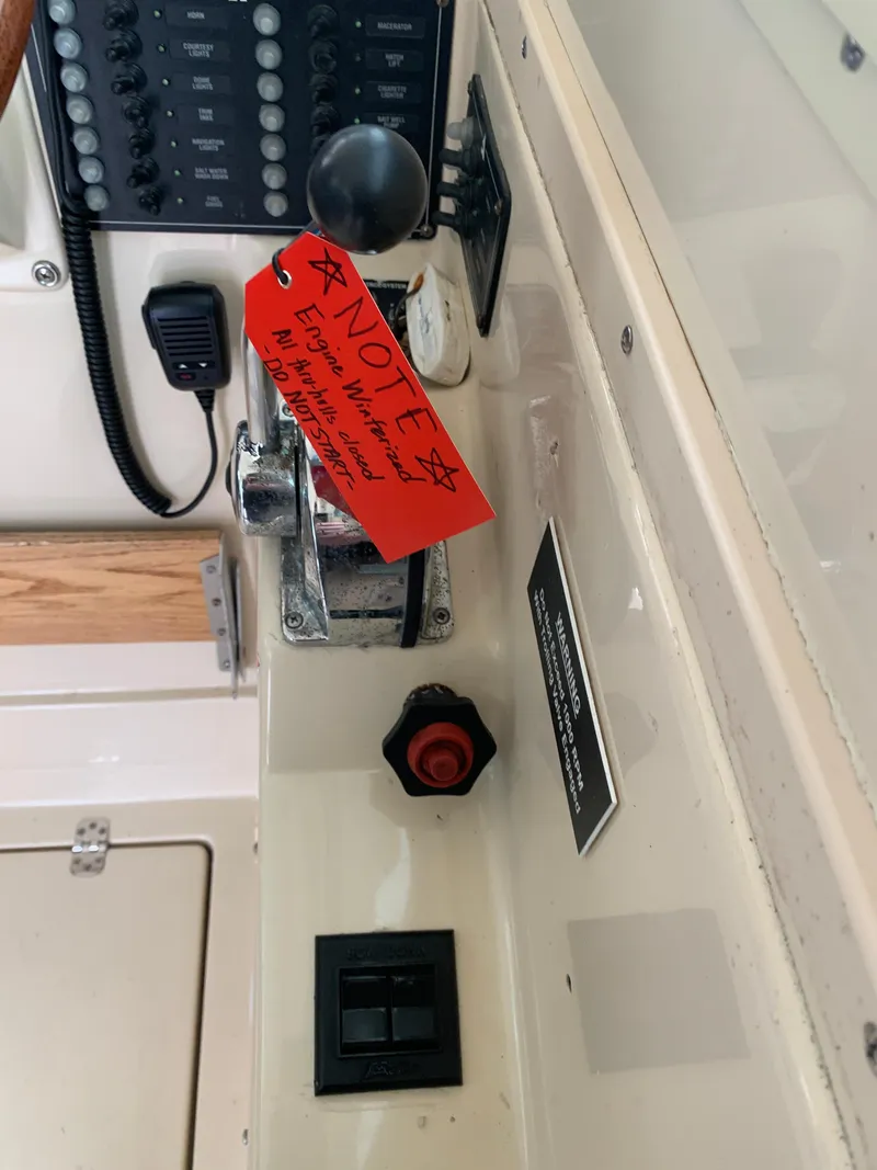 Slide: The Image of Control panel of 2006 Albin 28 Tournament Express with note attached to lever. - 46