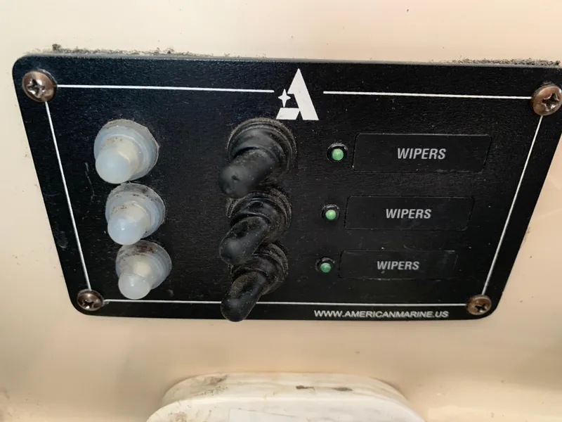 Slide: The Image of Control panel for wipers on a 2006 Albin 28 Tournament Express boat. - 48