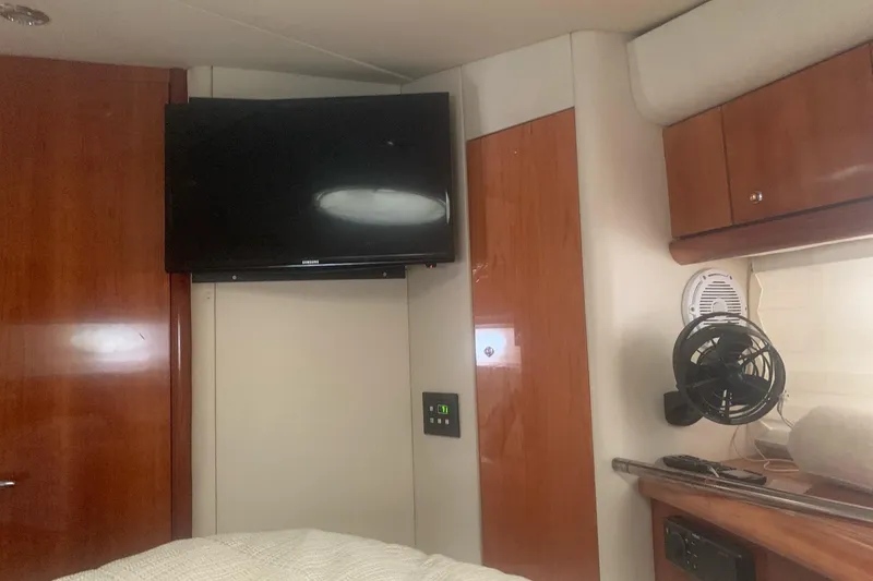 Slide: The Image of Interior of 2003 Sunseeker Predator 62 yacht with TV and wooden cabinetry. - 14