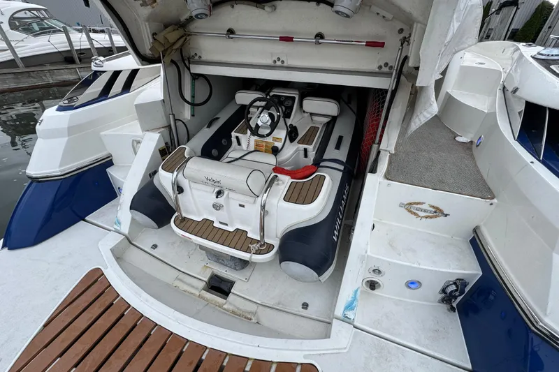 Slide: The Image of 2003 Sunseeker Predator 62 yacht with a Williams tender in the garage. - 16