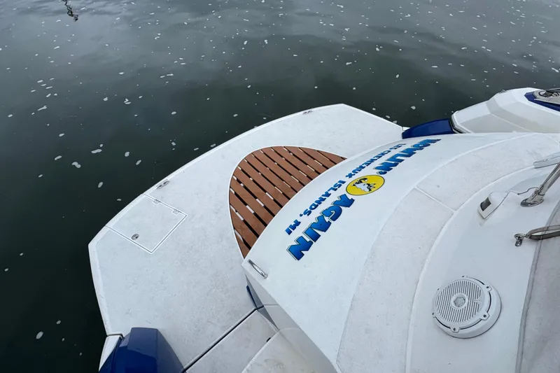 Slide: The Image of Rear deck of 2003 Sunseeker Predator 62 yacht on calm water. - 17