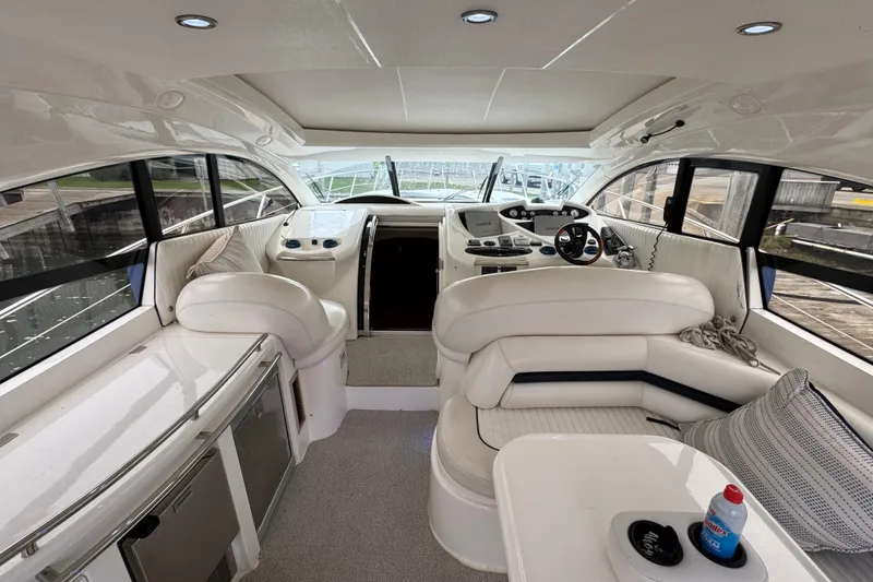 Slide: The Image of Luxurious interior of 2003 Sunseeker Predator 62 yacht with plush seating and modern helm. - 19