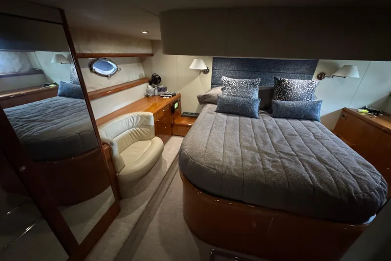 Slide: The Image of Luxurious bedroom interior of 2003 Sunseeker Predator 62 yacht with elegant furnishings. - 25