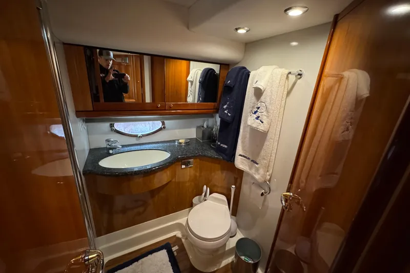 Slide: The Image of Luxurious bathroom in 2003 Sunseeker Predator 62 yacht with elegant wood finishes. - 27