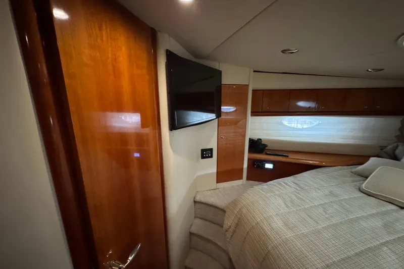 Slide: The Image of Luxurious cabin interior of 2003 Sunseeker Predator 62 yacht with wood finishes and modern amenities. - 31