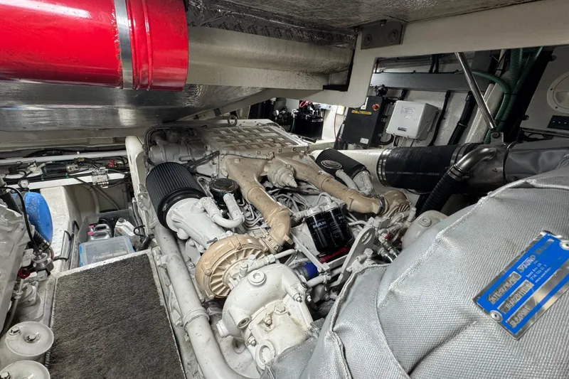 Slide: The Image of Engine room of a 2003 Sunseeker Predator 62 yacht, showcasing detailed machinery. - 33