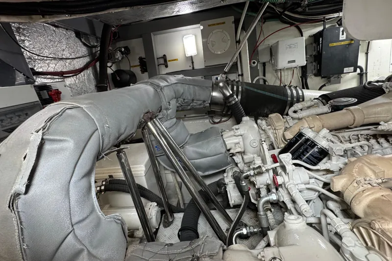 Slide: The Image of Engine room of a 2003 Sunseeker Predator 62 yacht, showcasing mechanical components. - 35