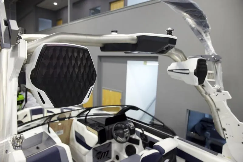 Slide: The Image of 2025 Malibu 26 LSV boat interior with advanced audio system and sleek design. - 11