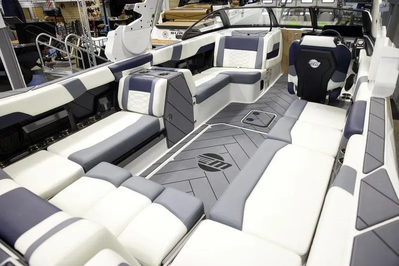 Slide: The Image of 2025 Malibu 26 LSV boat interior with luxurious seating and modern design. - 19
