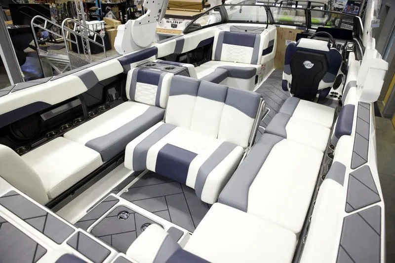 Slide: The Image of 2025 Malibu 26 LSV boat interior with luxurious seating and modern design. - 21