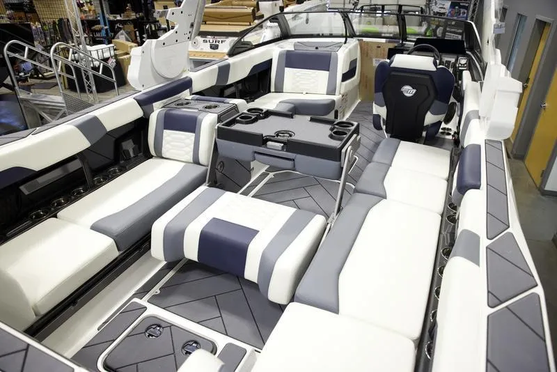 Slide: The Image of 2025 Malibu 26 LSV boat interior with luxurious seating and modern design. - 22