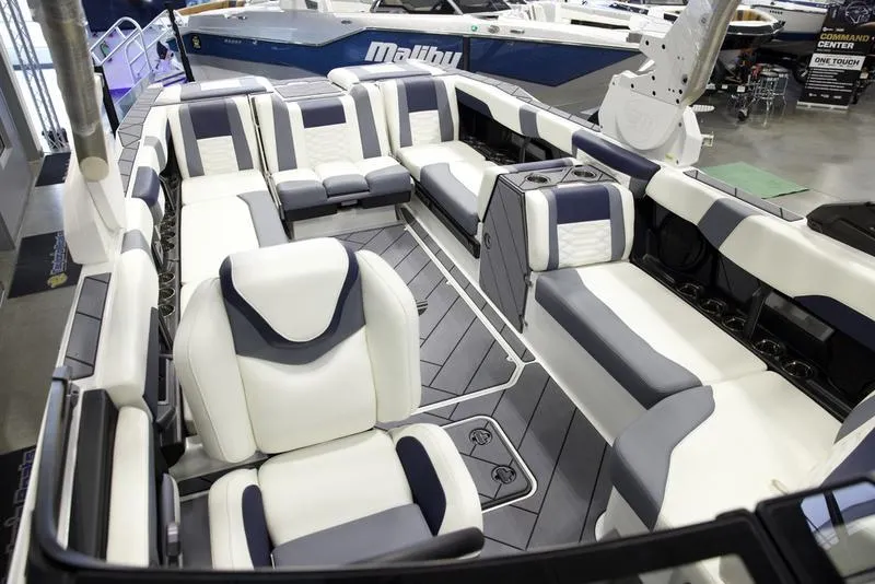 Slide: The Image of 2025 Malibu 26 LSV boat interior with luxurious seating and modern design. - 26