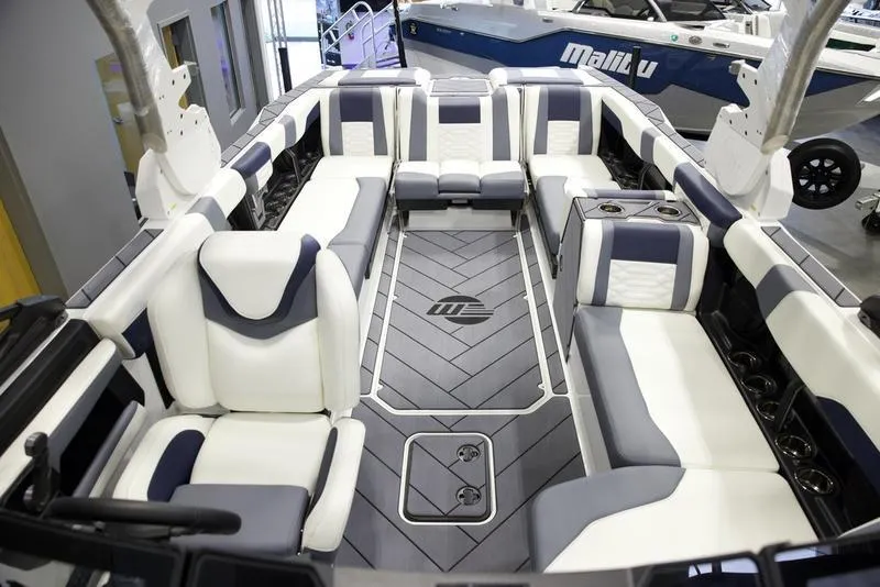 Slide: The Image of 2025 Malibu 26 LSV boat interior with luxurious seating and modern design. - 27