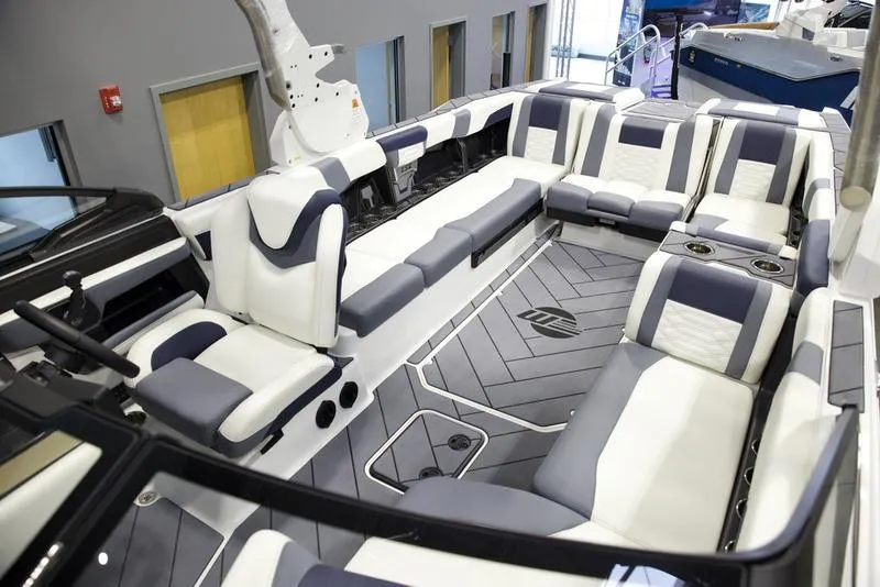Slide: The Image of Luxurious interior of 2025 Malibu 26 LSV boat with spacious seating and modern design. - 28