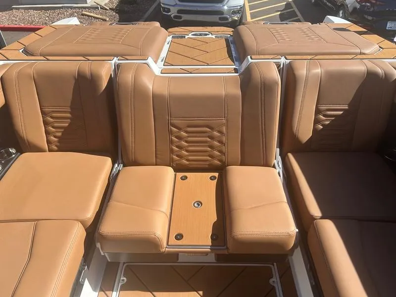 Slide: The Image of Luxurious tan leather seating in 2025 Malibu 26 LSV boat interior. - 20