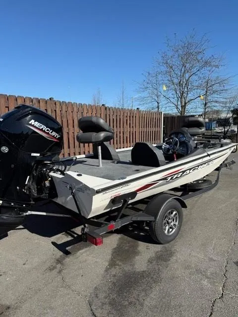 Slide: The Image of 2022 Tracker PRO175TE fishing boat with Mercury engine on trailer, parked outdoors. - 3