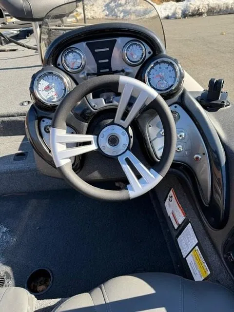 Slide: The Image of 2022 Tracker PRO175TE boat dashboard with steering wheel and gauges. - 4